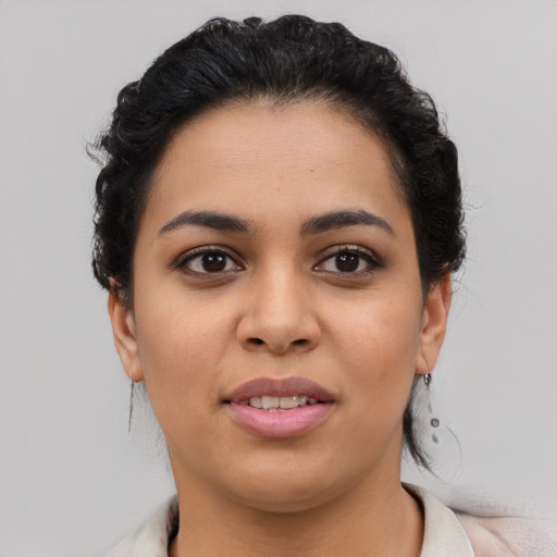 Joyful asian young-adult female with short  black hair and brown eyes
