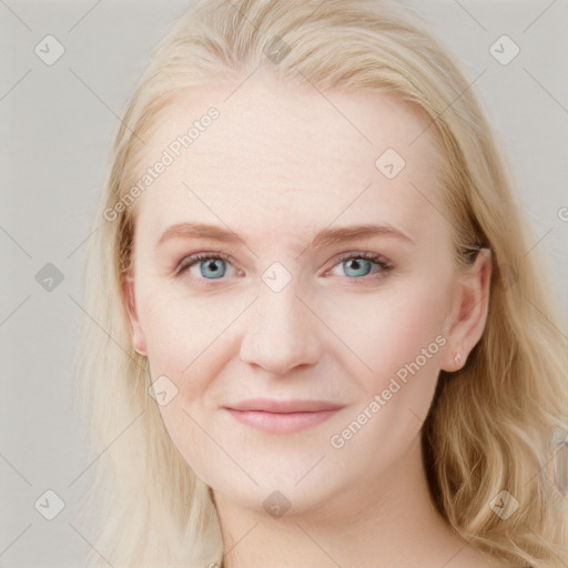 Joyful white young-adult female with long  brown hair and blue eyes
