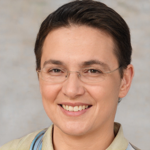 Joyful white adult female with short  brown hair and brown eyes