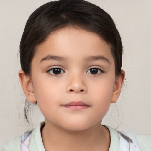 Joyful white child female with medium  brown hair and brown eyes