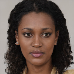 Neutral black young-adult female with long  brown hair and brown eyes
