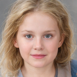 Joyful white child female with medium  brown hair and grey eyes