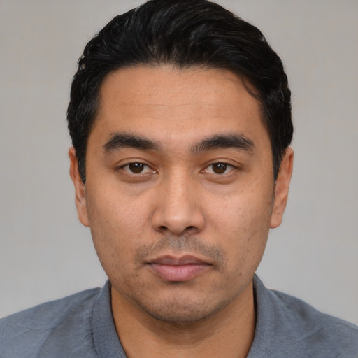 Neutral asian young-adult male with short  black hair and brown eyes