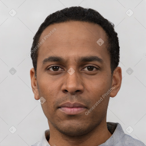 Neutral latino young-adult male with short  black hair and brown eyes