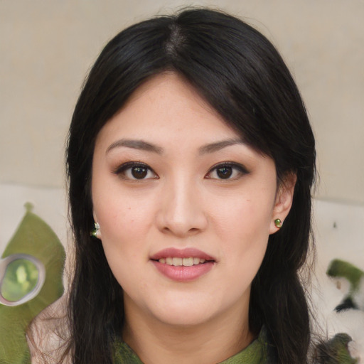 Joyful asian young-adult female with medium  black hair and brown eyes