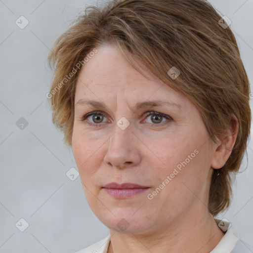 Joyful white adult female with medium  brown hair and grey eyes