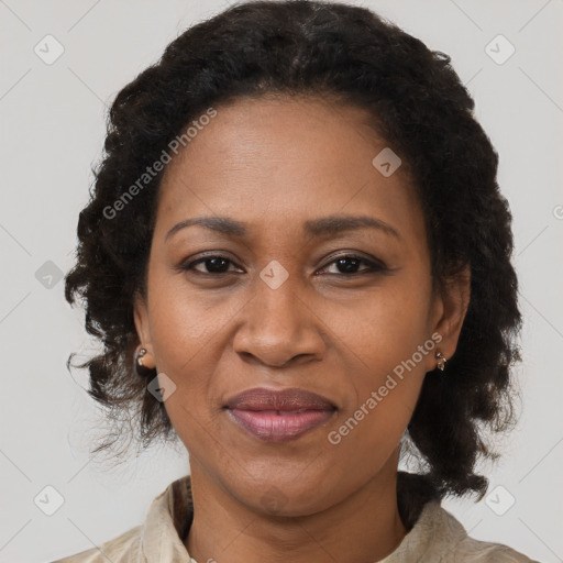 Joyful black adult female with medium  black hair and brown eyes