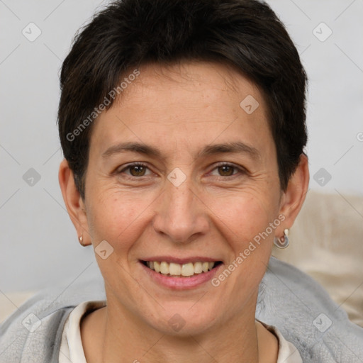 Joyful white adult female with short  brown hair and brown eyes