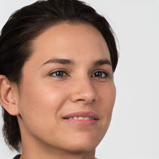 Joyful white young-adult female with medium  brown hair and brown eyes