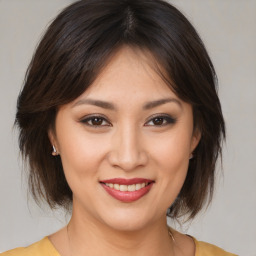 Joyful white young-adult female with medium  brown hair and brown eyes