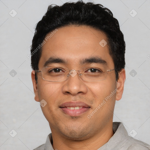 Joyful latino young-adult male with short  black hair and brown eyes