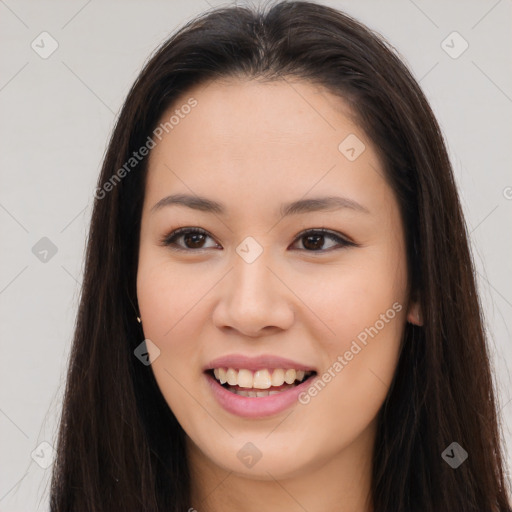 Joyful asian young-adult female with long  brown hair and brown eyes