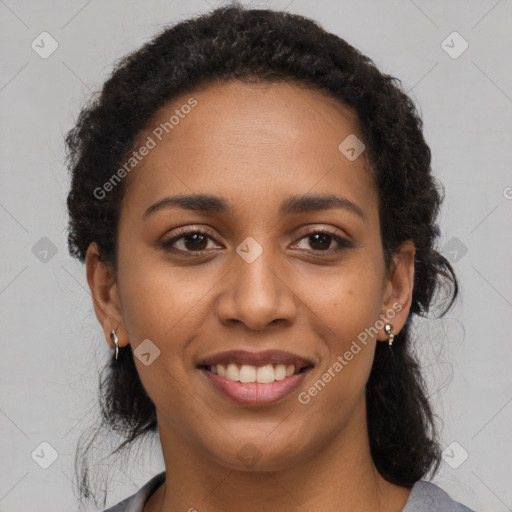 Joyful black young-adult female with long  brown hair and brown eyes