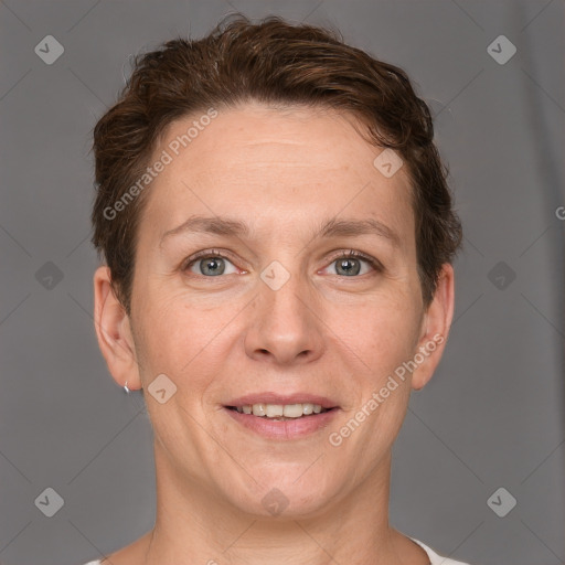 Joyful white adult female with short  brown hair and grey eyes