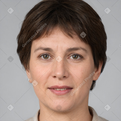 Joyful white adult female with short  brown hair and brown eyes