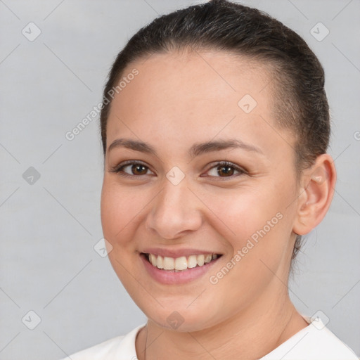 Joyful white young-adult female with short  brown hair and brown eyes