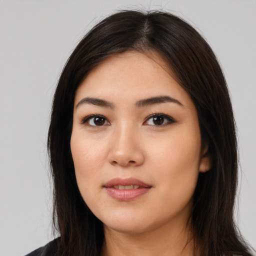 Joyful white young-adult female with long  brown hair and brown eyes