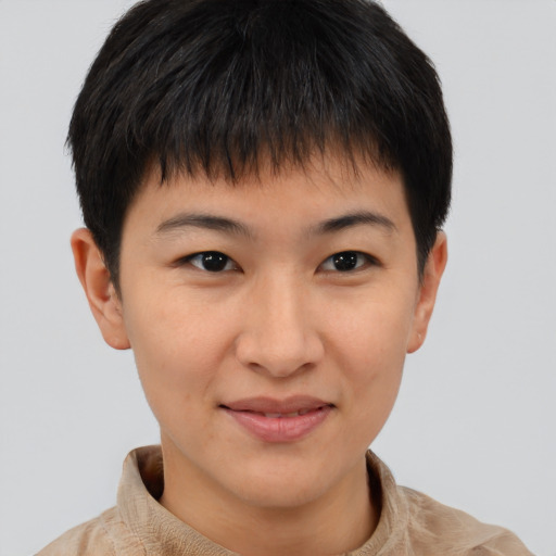 Joyful asian young-adult female with short  brown hair and brown eyes