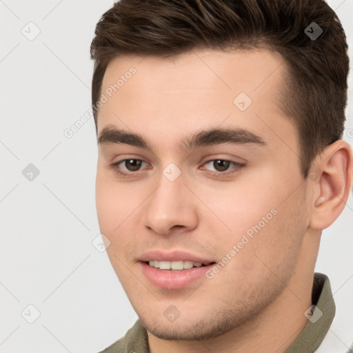 Joyful white young-adult male with short  brown hair and brown eyes