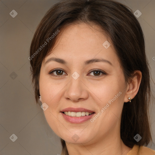 Joyful white adult female with medium  brown hair and brown eyes