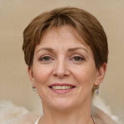 Joyful white adult female with short  brown hair and brown eyes