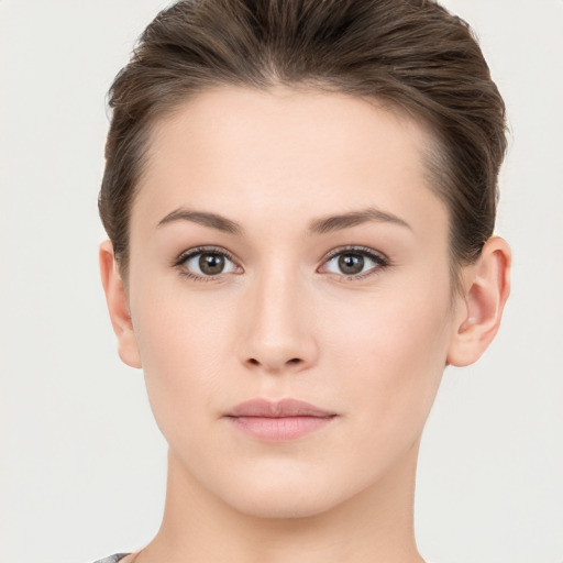 Neutral white young-adult female with short  brown hair and brown eyes