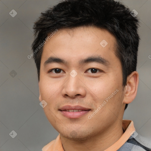 Joyful asian young-adult male with short  brown hair and brown eyes