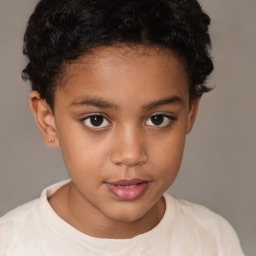 Joyful white child female with short  brown hair and brown eyes