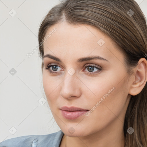 Neutral white young-adult female with long  brown hair and brown eyes