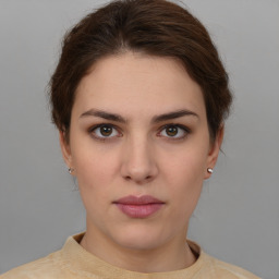 Neutral white young-adult female with short  brown hair and brown eyes