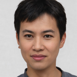 Joyful asian young-adult male with short  black hair and brown eyes