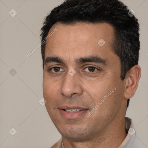 Joyful white young-adult male with short  black hair and brown eyes