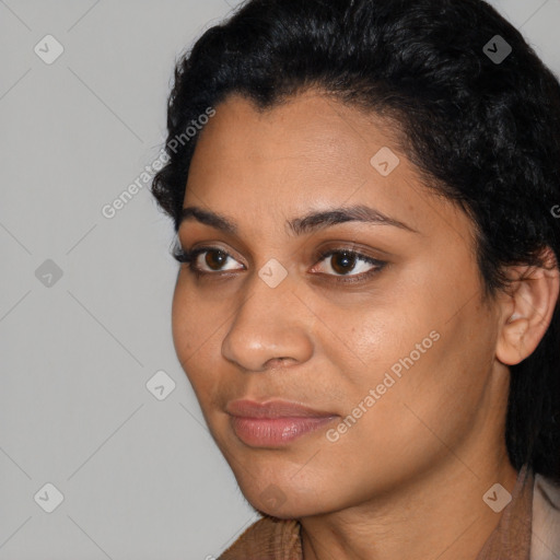 Joyful latino young-adult female with short  black hair and brown eyes