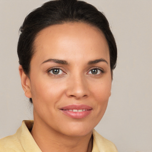 Joyful white young-adult female with medium  brown hair and brown eyes