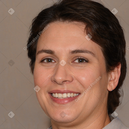 Joyful white adult female with medium  brown hair and brown eyes