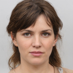 Neutral white young-adult female with medium  brown hair and grey eyes