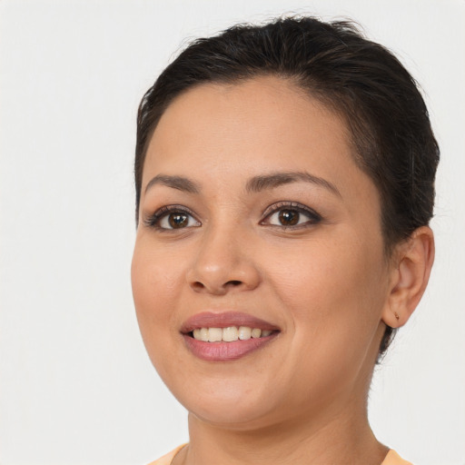 Joyful white young-adult female with short  brown hair and brown eyes