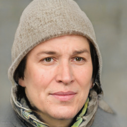 Joyful white adult female with short  brown hair and grey eyes