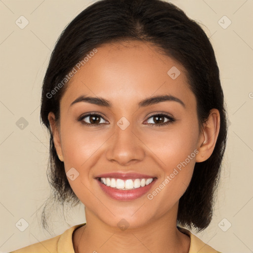 Joyful latino young-adult female with long  brown hair and brown eyes