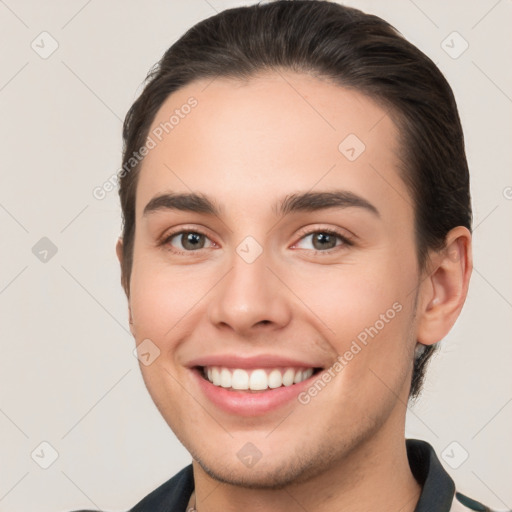 Joyful white young-adult female with short  brown hair and brown eyes