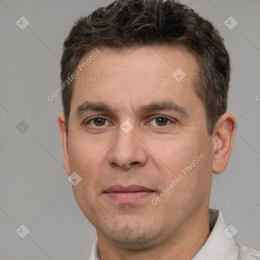 Joyful white adult male with short  brown hair and brown eyes