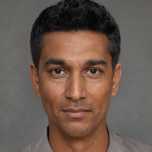 Neutral black adult male with short  black hair and brown eyes