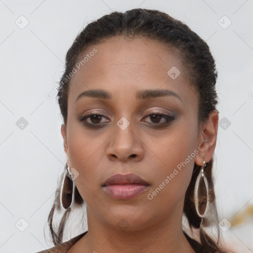 Neutral black young-adult female with long  brown hair and brown eyes