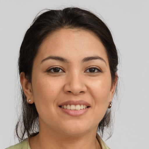 Joyful white young-adult female with medium  brown hair and brown eyes