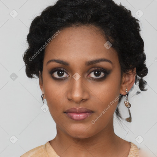 Joyful black young-adult female with long  black hair and brown eyes