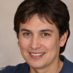 Joyful white young-adult male with medium  brown hair and brown eyes