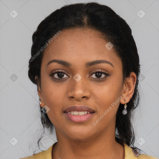 Joyful black young-adult female with long  black hair and brown eyes