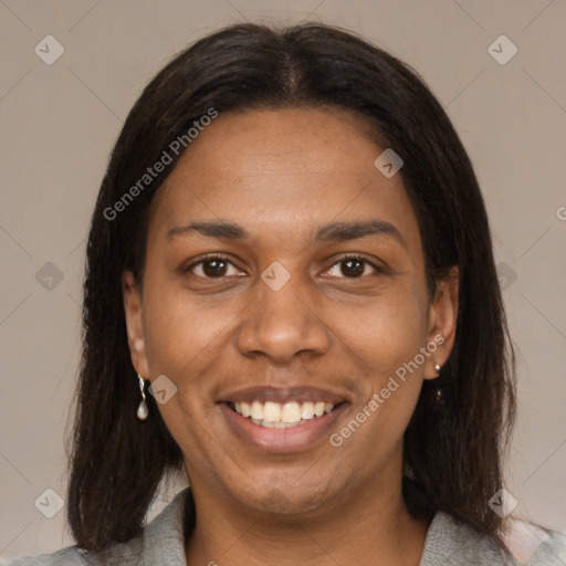 Joyful black young-adult female with medium  brown hair and brown eyes