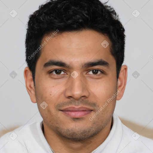 Joyful latino young-adult male with short  brown hair and brown eyes