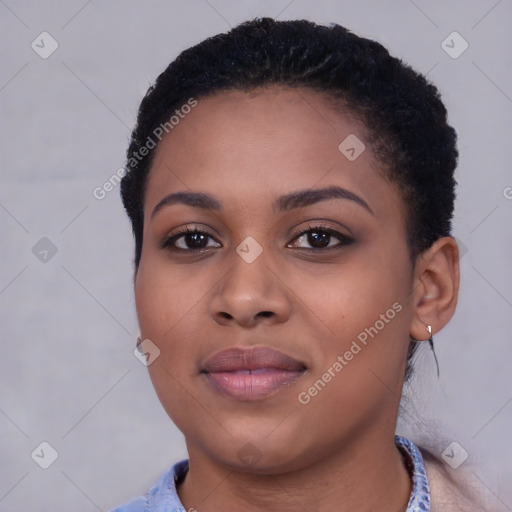 Joyful black young-adult female with short  black hair and brown eyes